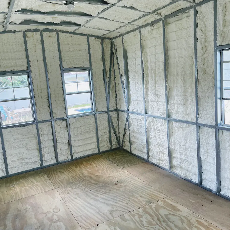 Closed-cell spray foam insulation applied to wall cavities in a residential project in Waukegan